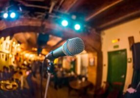 Microphone on stage against a background of auditorium